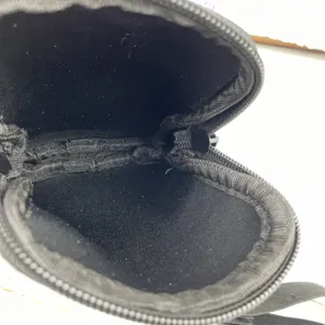 Macro detail of the soft black neoprene interior of a portable small coin purse