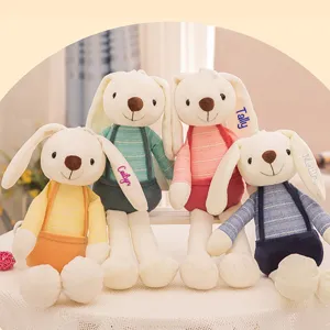 Detailed view of four colorful plush bunnies with custom name embroidery on ears