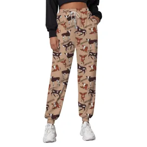 Detailed view of women's khaki cow print joggers with elastic waist and drawstring