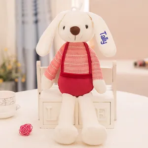 Detailed view of customized plush rabbit toy with blue embroidered name Tally on ear