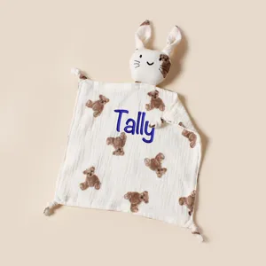 Close-up of customized embroidered name on a soft baby cotton bear print security blanket