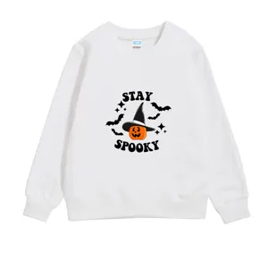 Detailed view of a white child's sweatshirt featuring a 'Stay Spooky' Halloween print