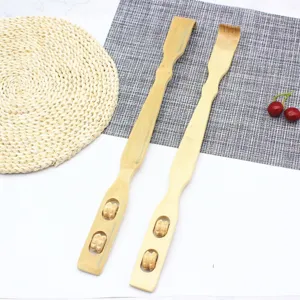 Bamboo back scratcher detail view, manual massager with dual rolling balls, natural wooden handheld tool.