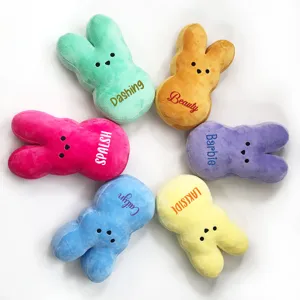 Detailed view of colorful bunny plush toys with custom embroidered names