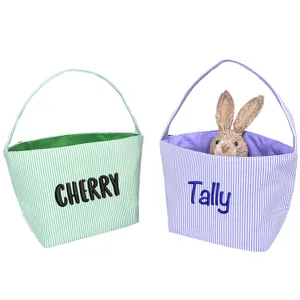 Detail view of personalized seersucker Easter baskets with custom name embroidery