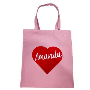 Personalized pink canvas tote bag featuring a red heart and custom name Amanda design