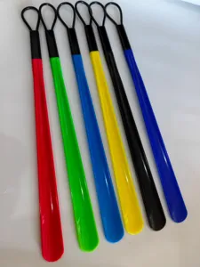 Colorful long handle plastic shoehorn detail shot, lightweight design, convenient helper.
