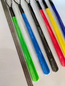 Long plastic shoe horn with hanging loop and 60cm length for easy wearing, colorful design.