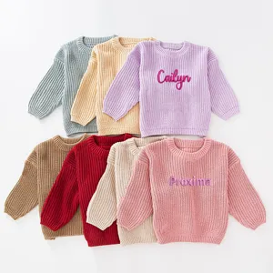 Collection of colorful custom embroidered knit sweaters for girls in various solid shades