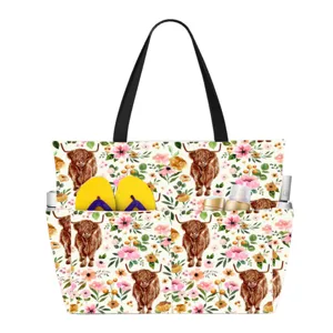 Detailed view of the large floral beach bag featuring a cute Highland cow print