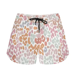 Close-up of colorful leopard print athletic shorts featuring a functional black adjustable drawstring