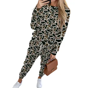 Detail of two-piece sweatsuit featuring cow print sweatshirt and jogger pants set