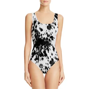 Front view of a women's one-piece swimsuit featuring a stylish black and white cow print