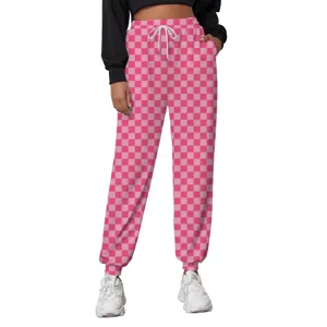 Close-up of pink checkered joggers with drawstring waist and elastic ankle cuffs