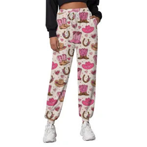 Detailed close-up view of white joggers featuring a cute pink cowboy boot and hat pattern print