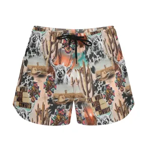 Detail view of western-style summer sports shorts with Highland cow and cactus graphic print