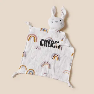 Detailed close-up of a customized baby rabbit security blanket with rainbow patterns