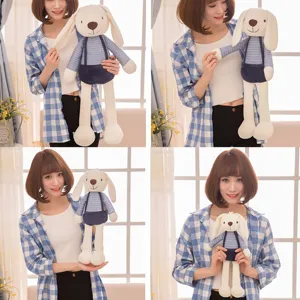 Size comparison of cute Sugar Bunny plush toy held by an Asian model in indoor setting