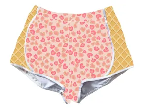 Detail of women's pink leopard and heart print shorts with waffle side panels.