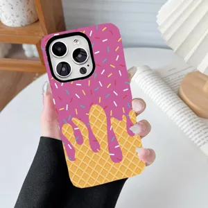 Detail of ice cream cake printed phone case held by hand in a cozy lifestyle setting