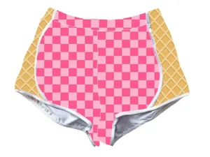 Macro view of stylish pink checkered and waffle pattern shorts with white piping