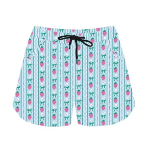 Detailed product view of casual shorts with cute strawberry and bow pattern print.