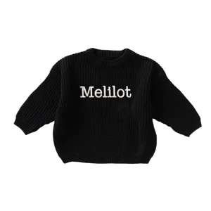 Customizable black chunky knit girls round neck sweater with white Melilot embroidery