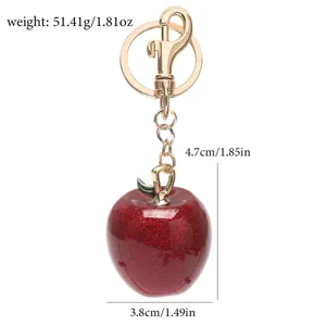Portachiavi mela rossa glitterata con dimensioni 4,7cm x 3,8cm e peso di 51,41g