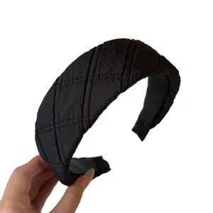 Classic black quilted padded headband for women, wide fabric hair hoop for daily wear.