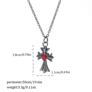 Detailed view of gothic cross necklace with red heart and dimensions.
