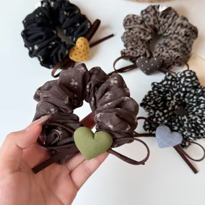 French style fabric hair scrunchies with cute heart charms, perfect for casual ponytails and buns.