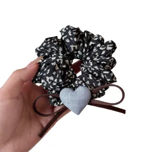 French style leopard print scrunchie with cute grey heart and brown bow hair accessory.