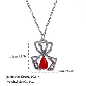 Detailed macro view of gothic black spider pendant with red drop and size information