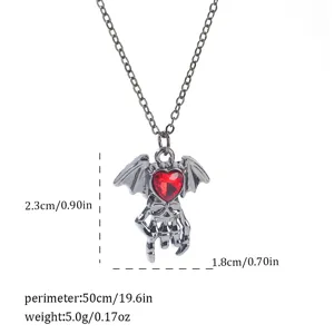 Detailed view of the gothic bat skull necklace with red heart stone and measurements.