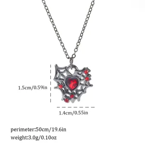 Close-up of a gothic spider web necklace with a red heart and exact dimensions.