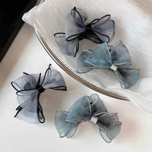 Detail view of Korean sweet gradient mesh bow claw clips with delicate stitched edge design.
