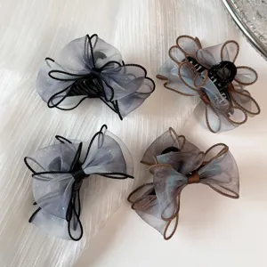 Details of Korean style gradient organza bow hair claw, elegant hair accessory for women.