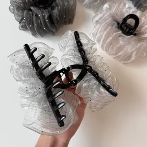 Shimmering organza hair claw with rhinestones, elegant puffy cloud design for thick hair styling.