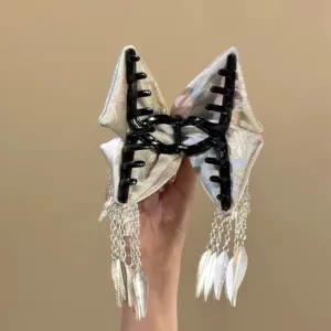 Neo-Chinese embroidered hair claw clip with delicate metal leaf tassels for elegant buns and styling.