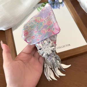 Chinese style fabric hair claw clip with silver floral tassel, elegant hair accessory.
