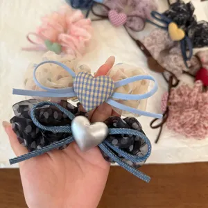 Carini elastici per capelli a pois in rete con fiocchi a cuore, morbidi accessori da donna.