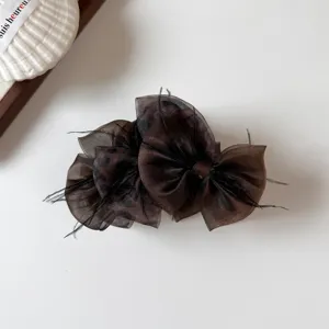 Korean style brown leopard print bow hair claw clip with feather detail, elegant hair accessory.