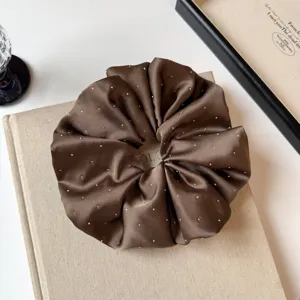 Brown satin rhinestone scrunchie hair tie, elegant sparkling hair accessory for low ponytail.