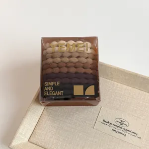 Boxed gradient brown hair ties set, durable elastic rubber bands for daily ponytail styling.
