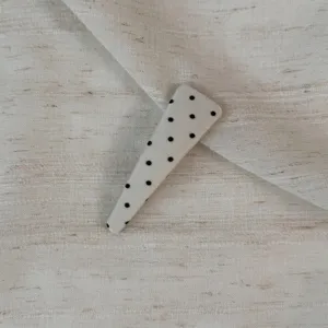 Cute beige polka dot hair clip, side bangs snap clip detail, Korean style hair accessory.