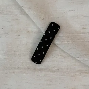 Black and white polka dot fabric snap hair clip, stylish and cute hair accessory for women.