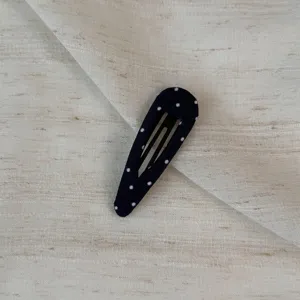 Black polka dot snap hair clip, stylish fabric wrapped cute hair accessory for daily wear.