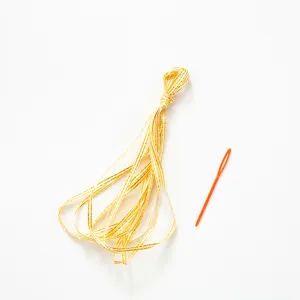 Gold glitter ribbon bundle with orange plastic needle for wedding party banner assembly
