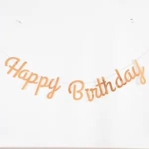 Elegant rose gold metallic Happy Birthday banner garland for baby's first party decor.
