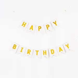 Elegant gold foil Happy Birthday banner featuring white swallowtail cardstock flags for parties